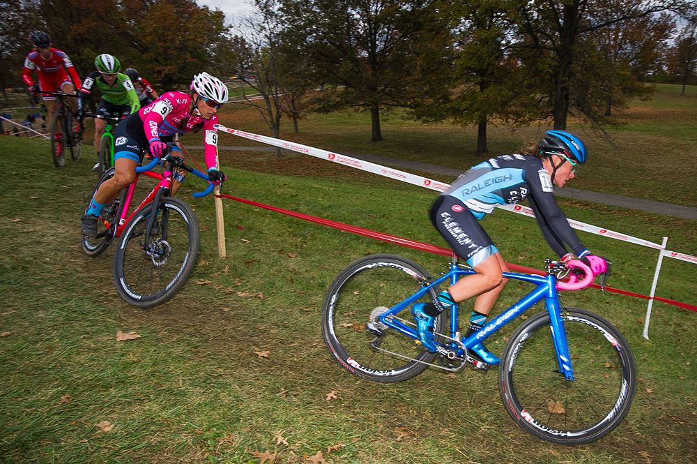 Caroline Mani (Raleigh Clement) leading a small group of riders down a short descent.