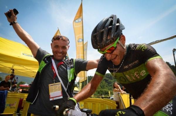 Kevin Evans and his team mechanic celebrate his win