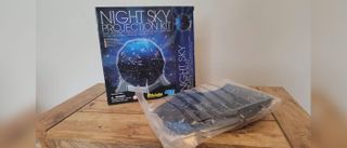 4M create a night sky projection kit laid out on a table