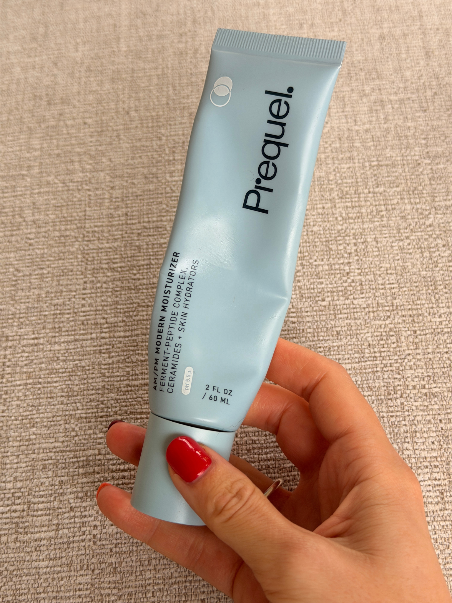 Freelance beauty editor Grace Day holding the Prequel moisturiser
