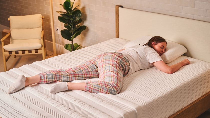 A person lying on their stomach on the Leesa Legend Hybrid Mattress