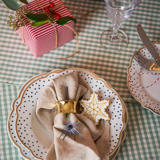 Dining table with green check cloth and christmas decor