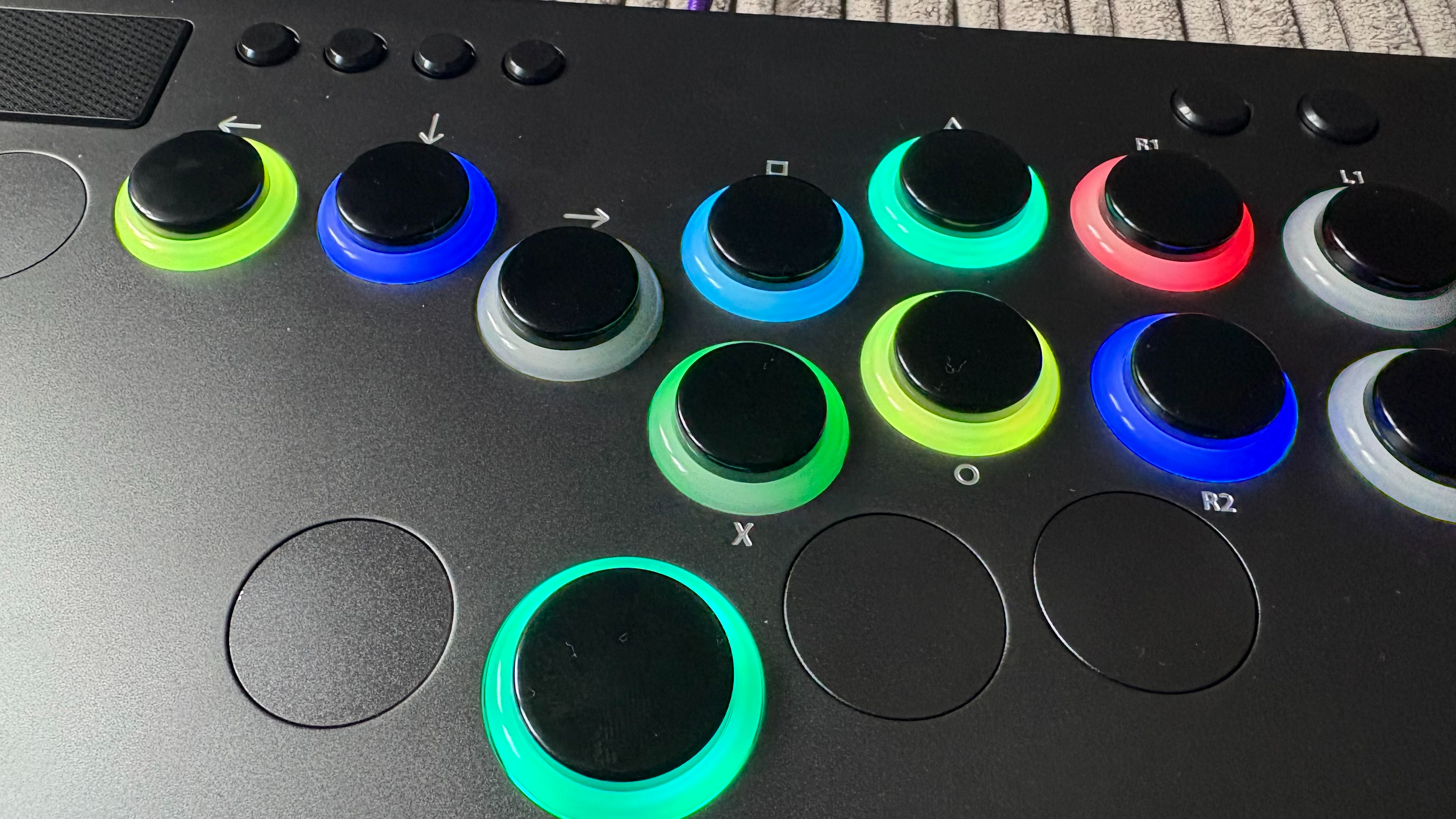 A top-down image of the Victrix Pro KO leverless fight stick's buttons and lighting