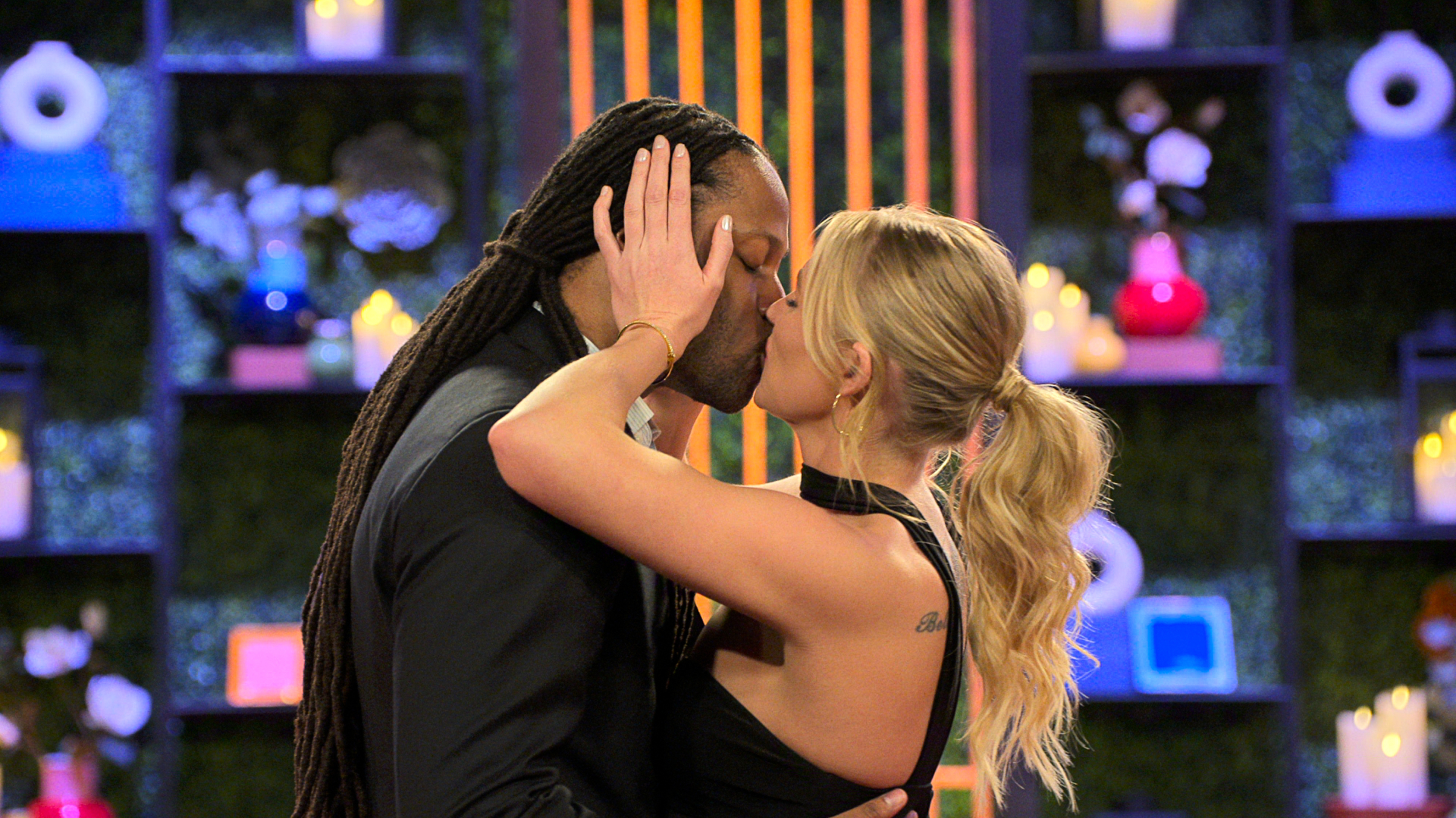 Dr Vic St John and Christine Hamilton kiss during their in-person reveal, in episode 1002 of Love Is Blind.