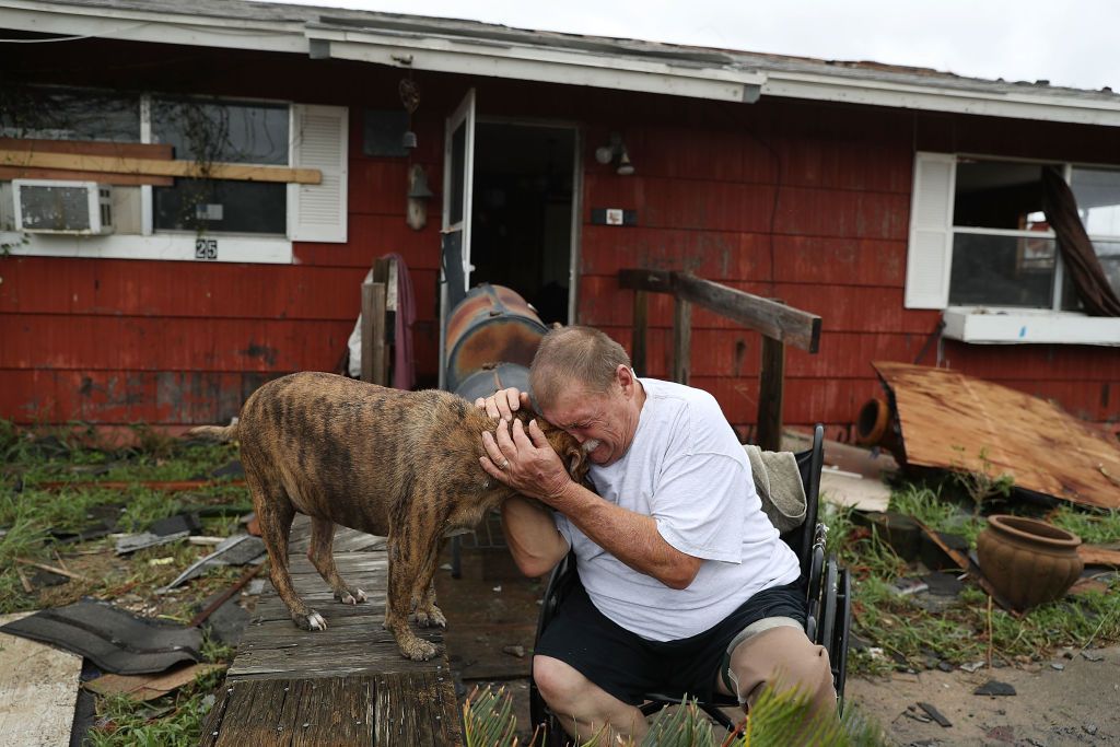 Steve Culver cries with his dog Otis as he talks about what he said was the, &amp;#039;most terrifying event in his life,&amp;#039; when Hurricane Harvey blew in and destroyed most of his home while he and his