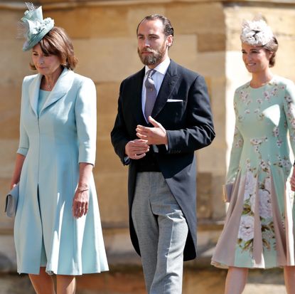 Carole, James and Pippa Middleton walking into Prince Harry and Meghan Markle's wedding wearing dress clothes