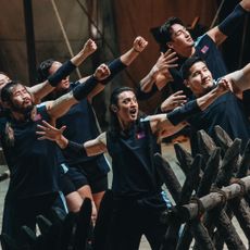 Six athletes from Team Mongolia (l-r Khandsuren Gantogtokh, Enkh-Orgil Baatarkhuu, Adiyasuren Amarsaikhan, Lkhagva-Ochir Erdene-Ochir, Dulguun Enkhbat, Orkhonbayar Bayarsaikhan) make a pose of holding a bow and arrow, in Netflix's 'Physical: Asia'.