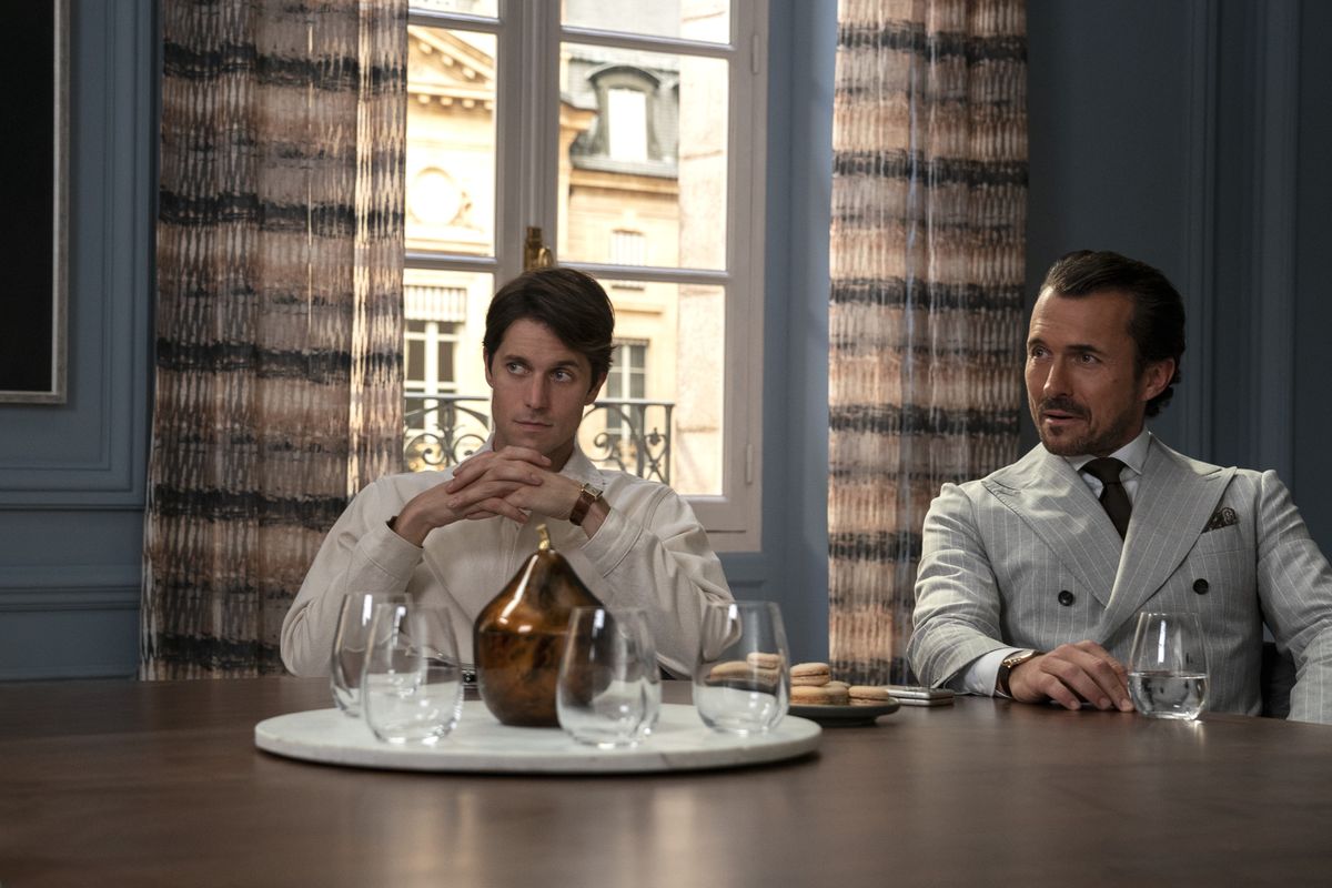 Emily in Paris L to R Lucas Bravo as Gabriel William Abadie as Antoine Lambert in episode 301 of Emily in Paris Cr Stphanie BranchuNetflix 2022