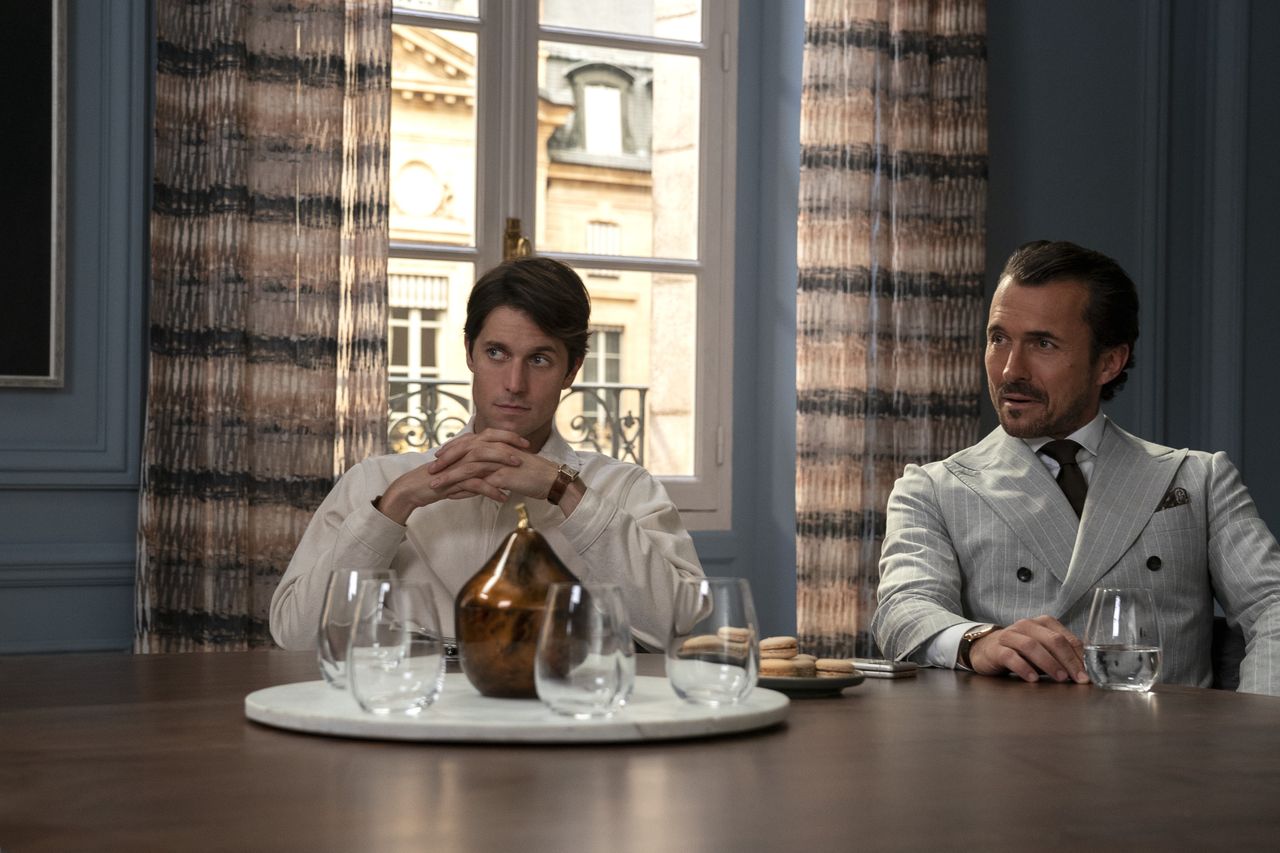 Emily in Paris L to R Lucas Bravo as Gabriel William Abadie as Antoine Lambert in episode 301 of Emily in Paris Cr Stphanie BranchuNetflix 2022