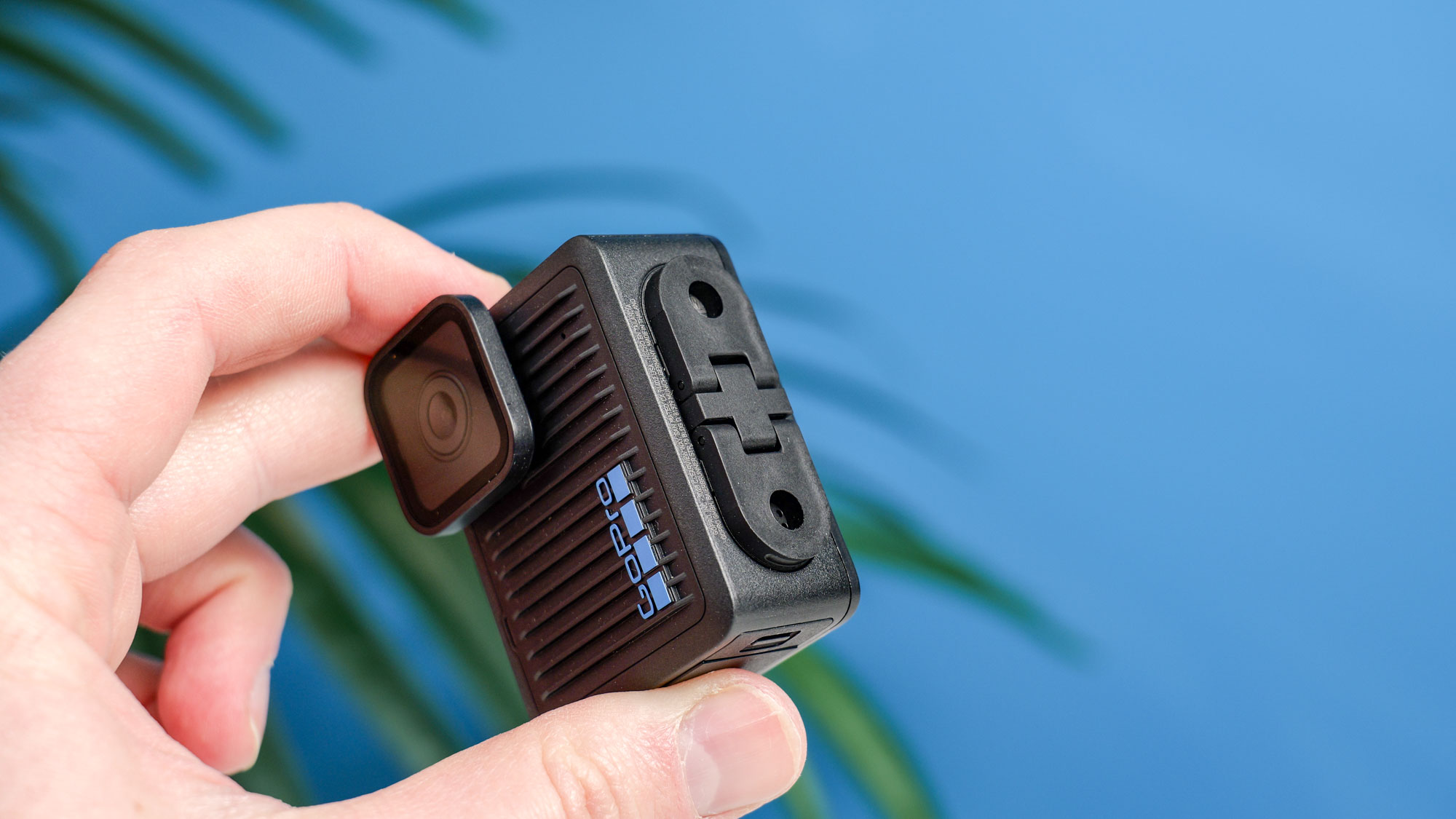 The GoPro Hero (2024) in hand with its forks folded flat