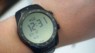 Essential mode on the Ticwatch Pro with heart rate, time, date and step count on display