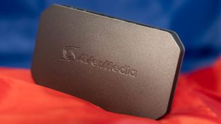 Avermedia Live Gamer Ultra 2.1 capture card on a red and blue background.