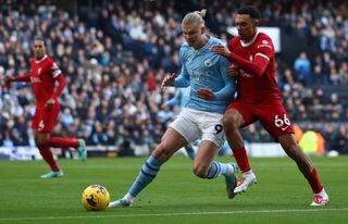 Erling Haaland and Trent Alexander-Arnold in action against each other