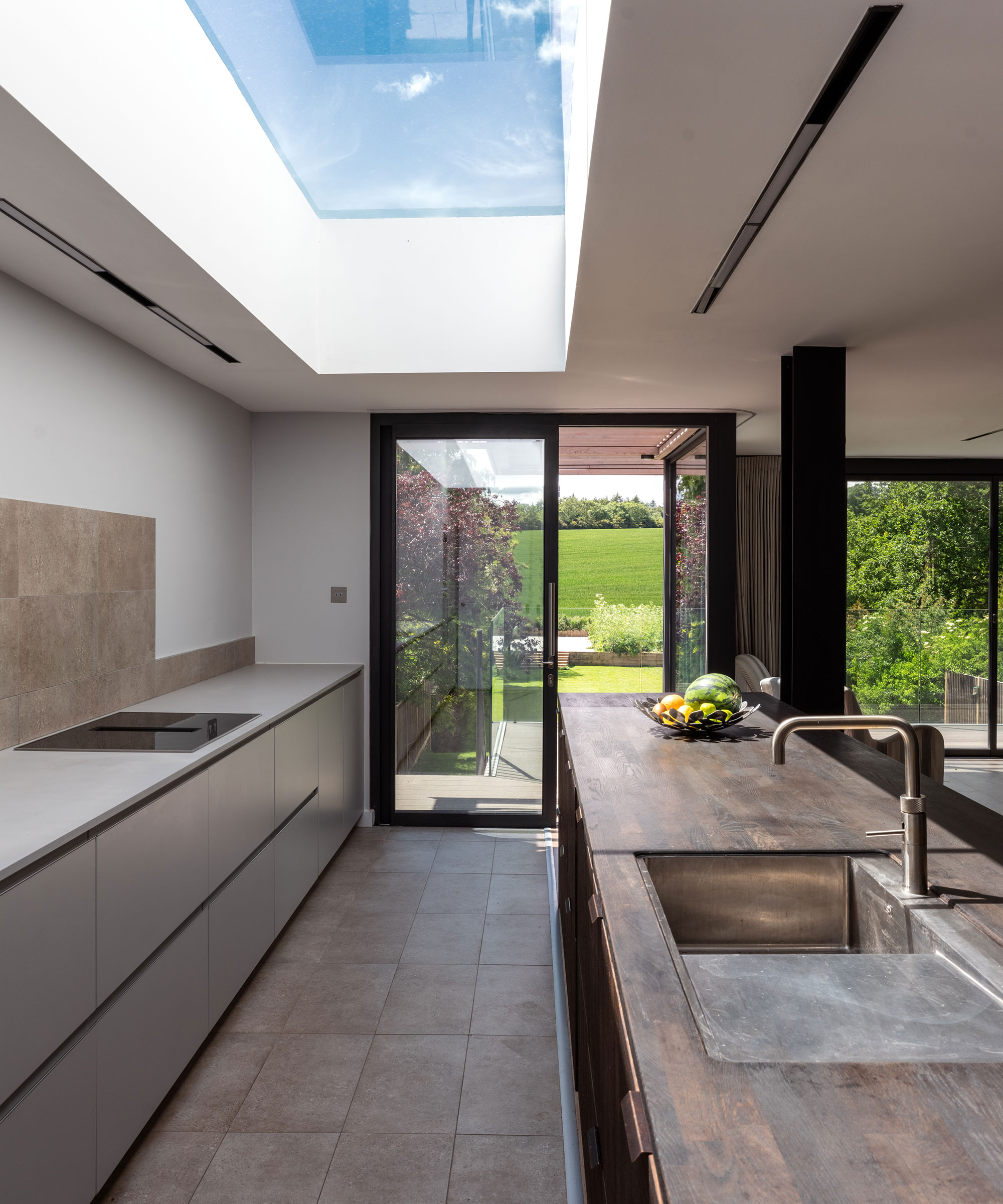 modern galley kitchen with rectangular roof lantern