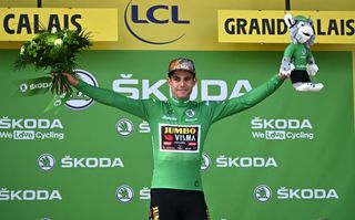 JumboVisma teams Belgian rider Wout Van Aert wearing the sprinters green jersey celebrates on the podium after winning the 4th stage of the 109th edition of the Tour de France cycling race 1715 km between Dunkirk and Calais in northern France on July 5 2022 Photo by AnneChristine POUJOULAT AFP Photo by ANNECHRISTINE POUJOULATAFP via Getty Images