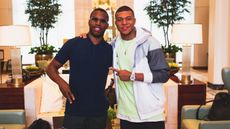 Former Liverpool striker Daniel Sturridge poses for a picture with French star Kylian Mbappe