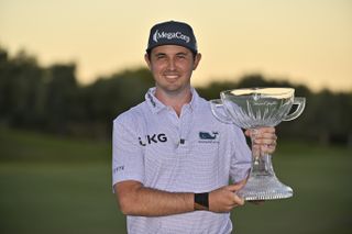 J.T. Poston holds up the 2024 Shriners Children's Open trophy