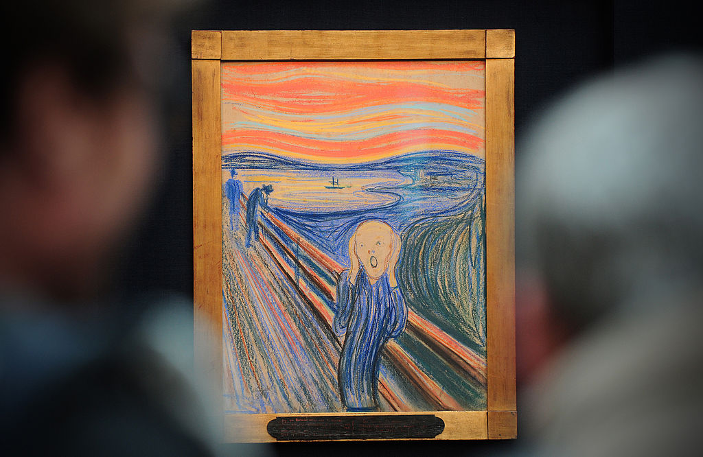 People view the Norwegian artist Edvard Munch's 1895 pastel on board work entitled 'The Scream' at Sotheby's auction house