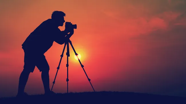 photographer at sunset