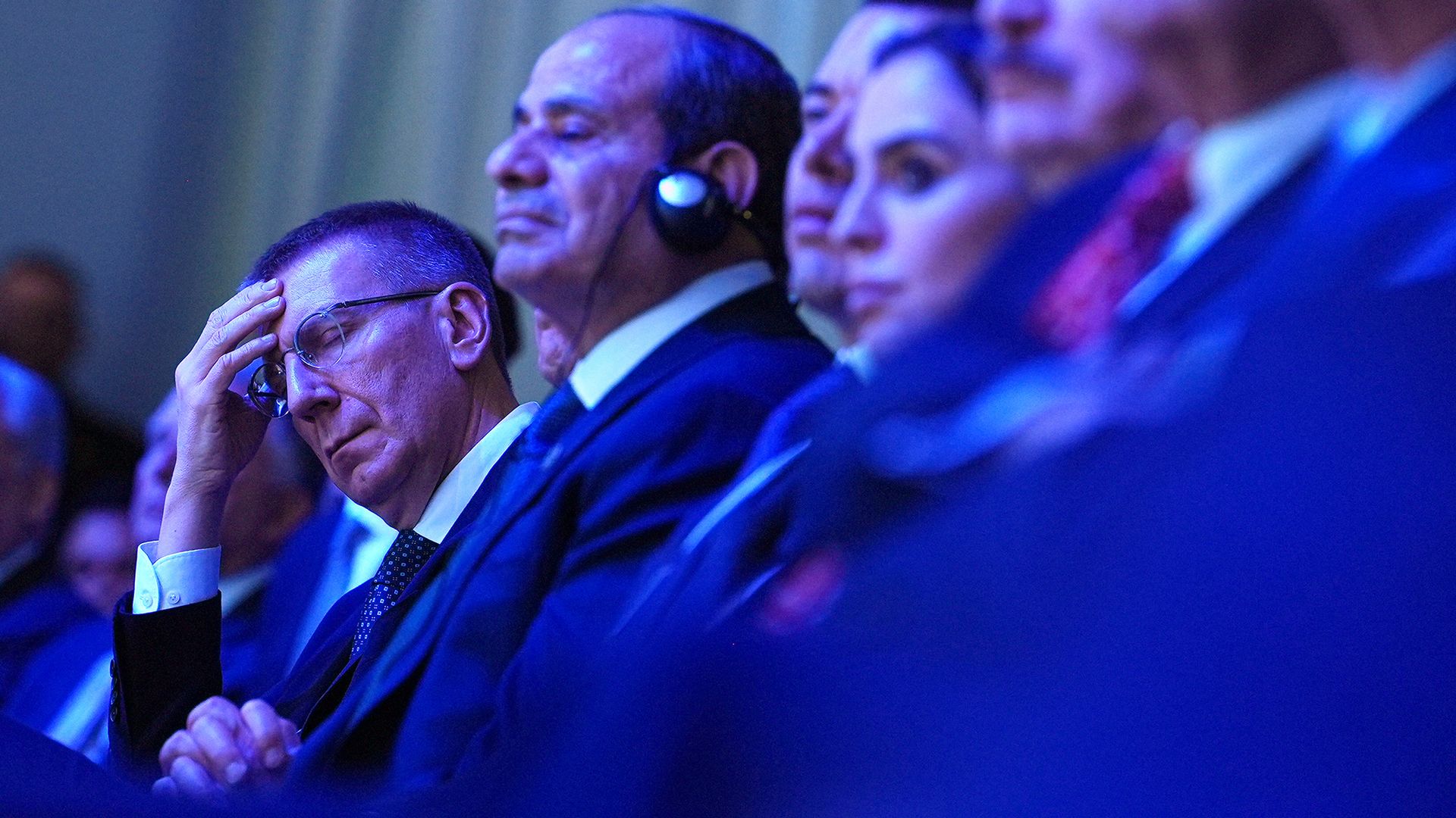 
                                Latvia's president Edgars Rinkēvičs (L) listens to Donald Trump's address during the World Economic Forum in Davos, Switzerland
                            