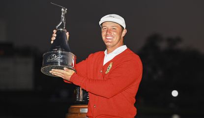 Bryson holds the trophy