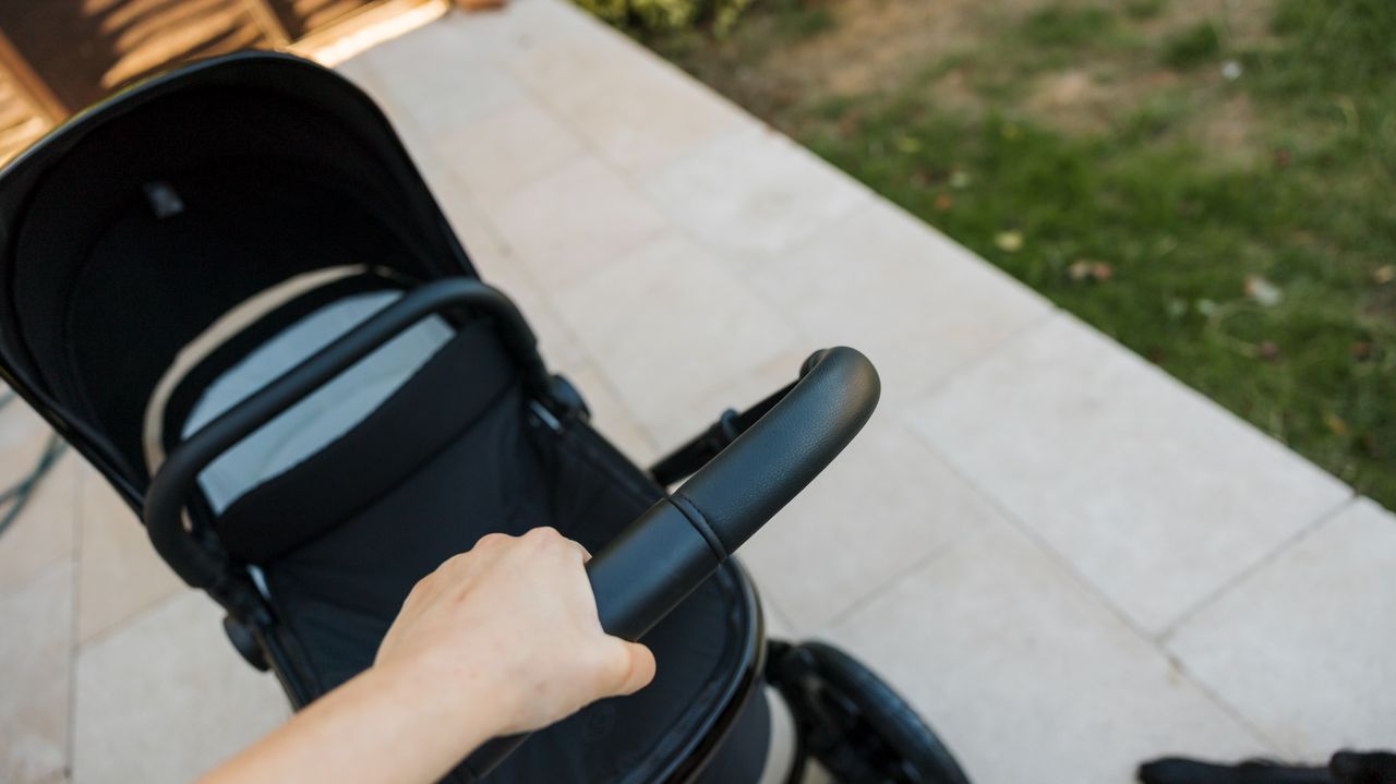A close-up of the Ickle Bubba Stomp Luxe Elements pram handle