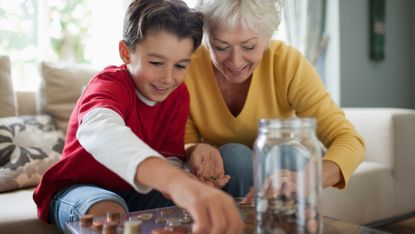 Grandmother and grandson counting coins