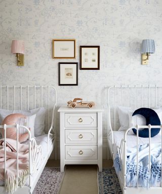 twin boy and girls bedroom with blue and pink decor and vintage pieces