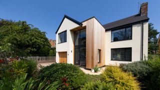 the outside of a modern renovation to a 1960s home