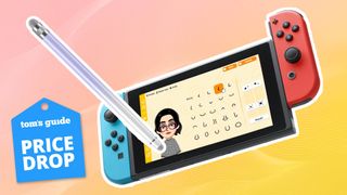 Nintendo Switch console displaying Tomodachi Life: Living the Dream game promotional image with a Bopomofo touch screen stylus overlaid