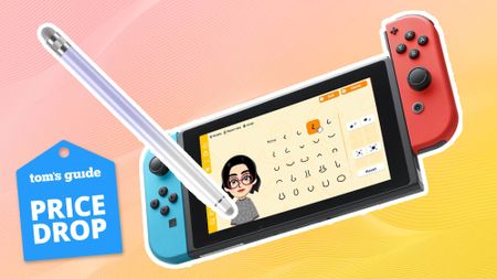Nintendo Switch console displaying Tomodachi Life: Living the Dream game promotional image with a Bopomofo touch screen stylus overlaid