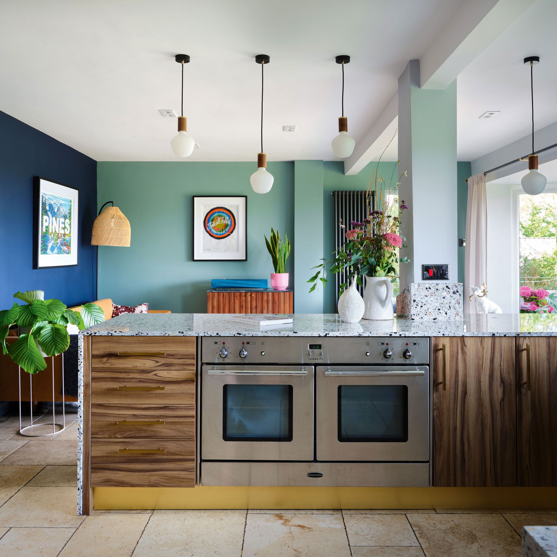 Peninsula unit with built-in ovens and views of the living room.