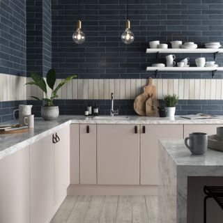 White kitchen cupboards with blue walls and open shelving