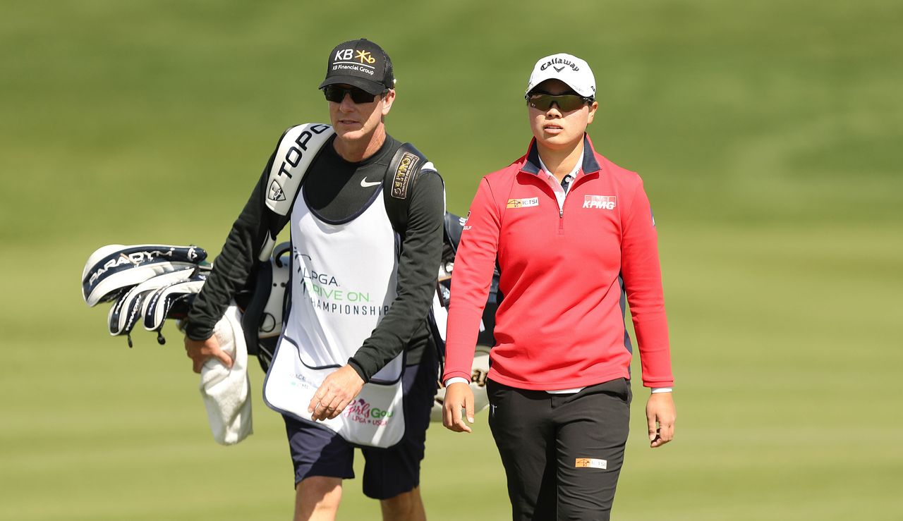 Saso walks with her caddie at the Drive On Championship