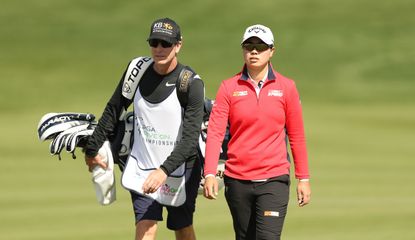 Saso walks with her caddie at the Drive On Championship