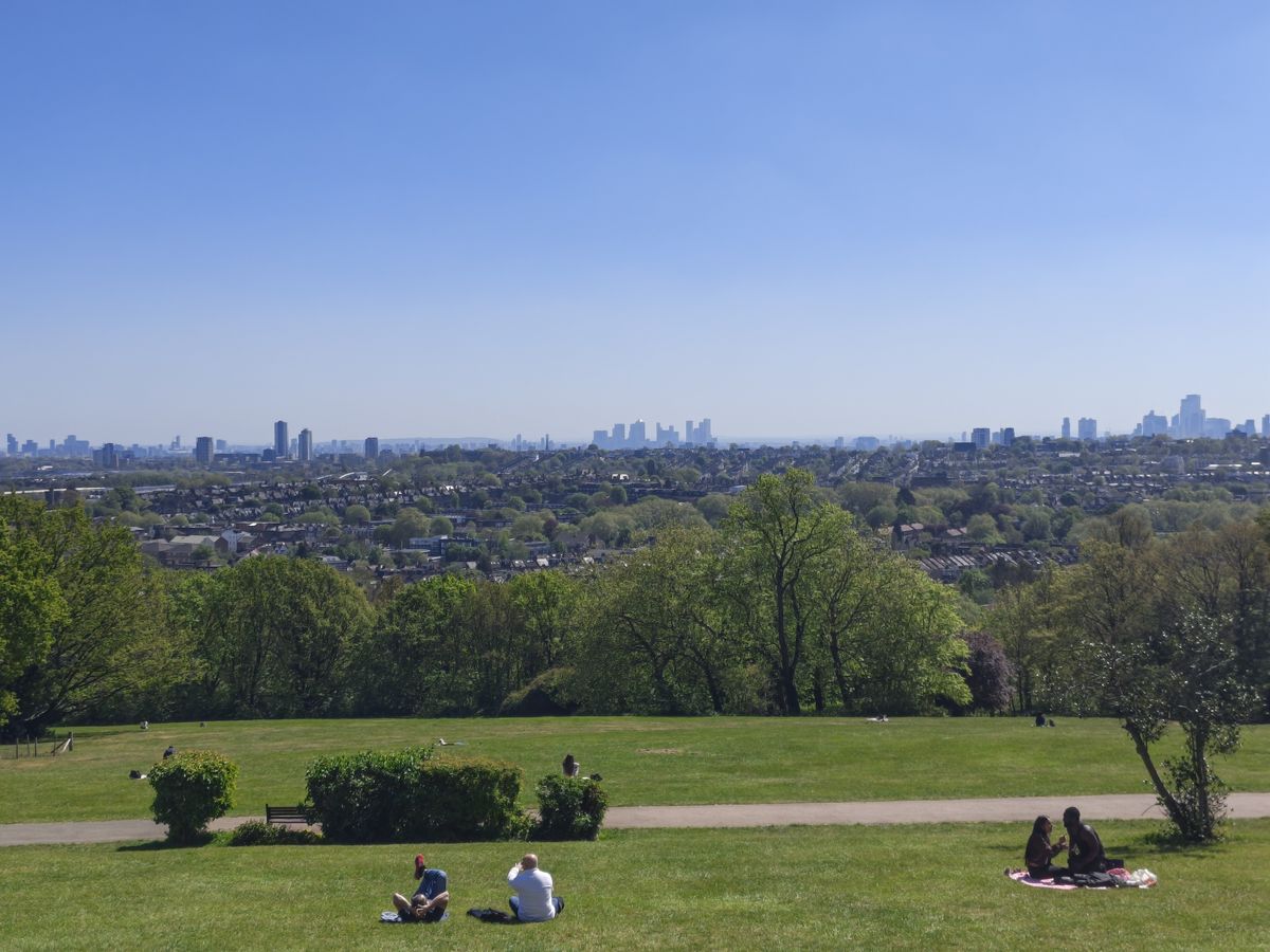 A camera sample taken on the Motorola Edge 70 Fusion, showing a park and distant city-scape.