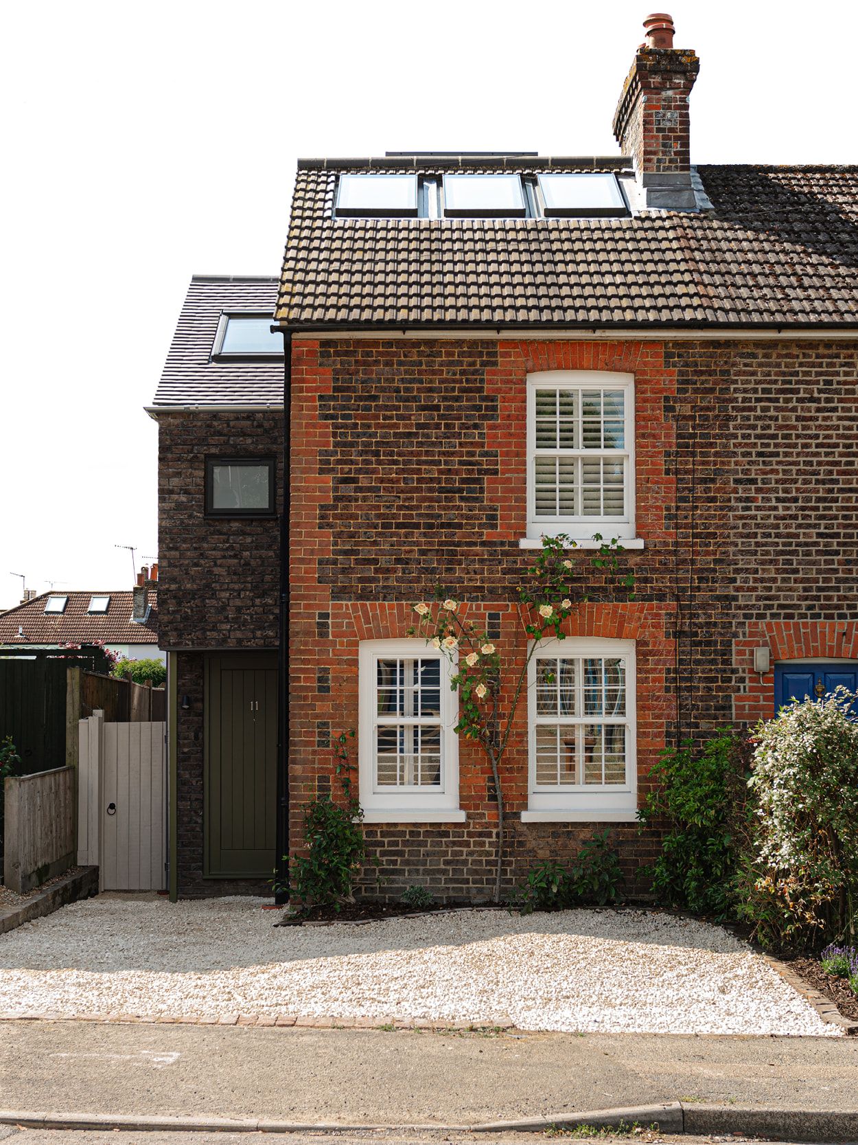 The exterior of a brick Victorian end of terrace house