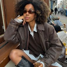 woman in brown jacket and cardigan