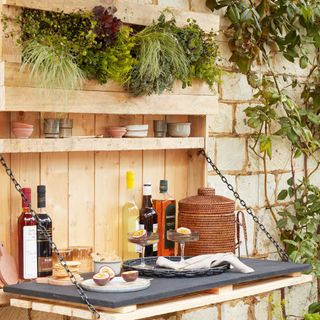 wooden folding bar with foliage and bottle