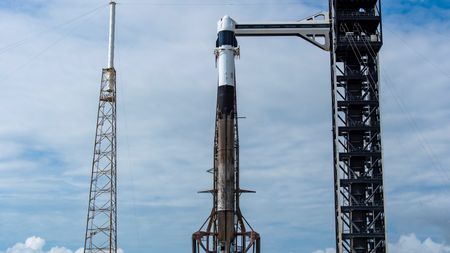 A SpaceX Falcon 9 rocket on the pad at Cape Canaveral Space Force Station ahead of the planned May 13, 2026 launch of the CRS-34 cargo mission to the International Space Station. The attempt was scrubbed due to bad weather.