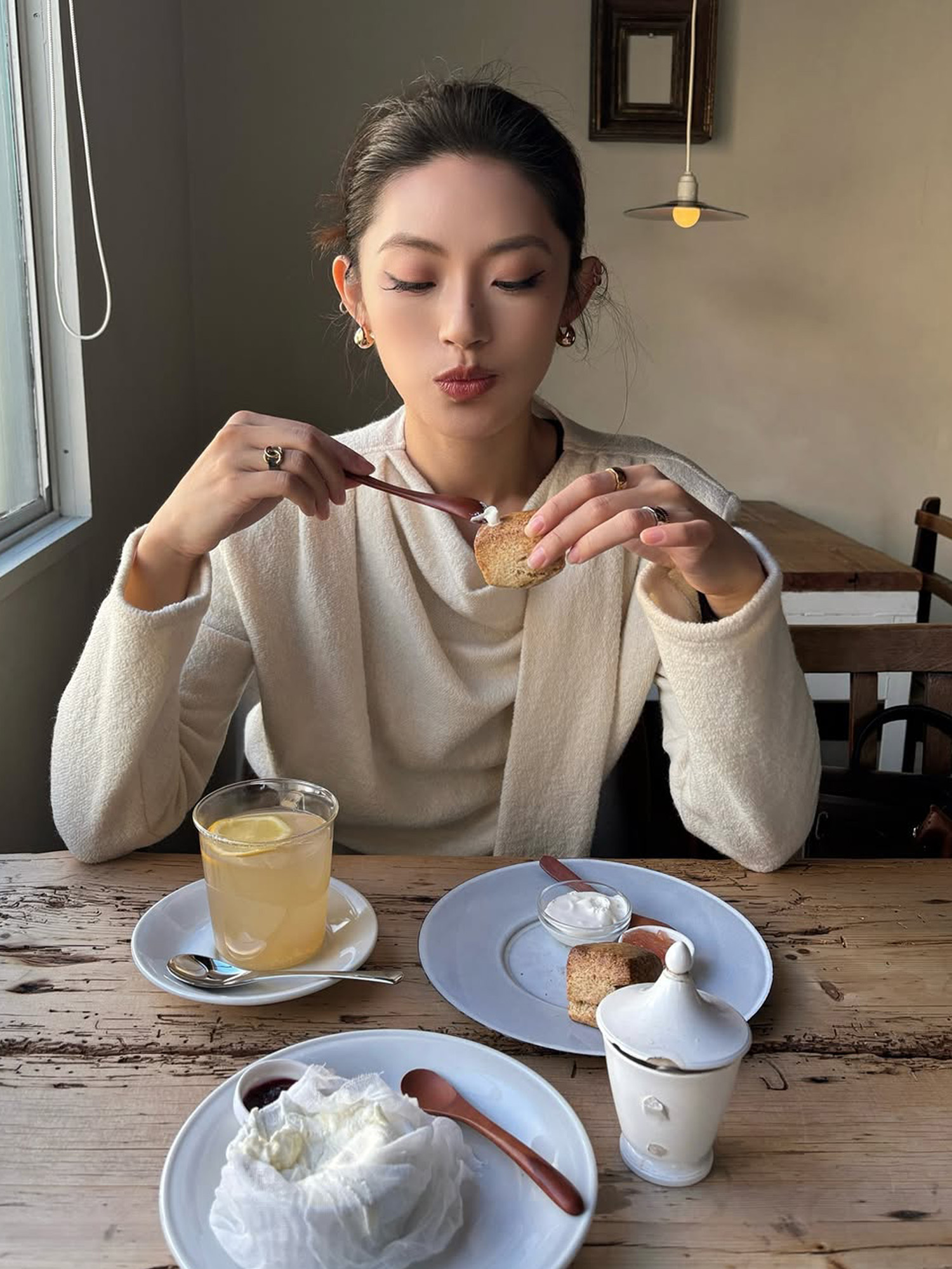 Michella Choi with a natural makeup look and pulled back hair