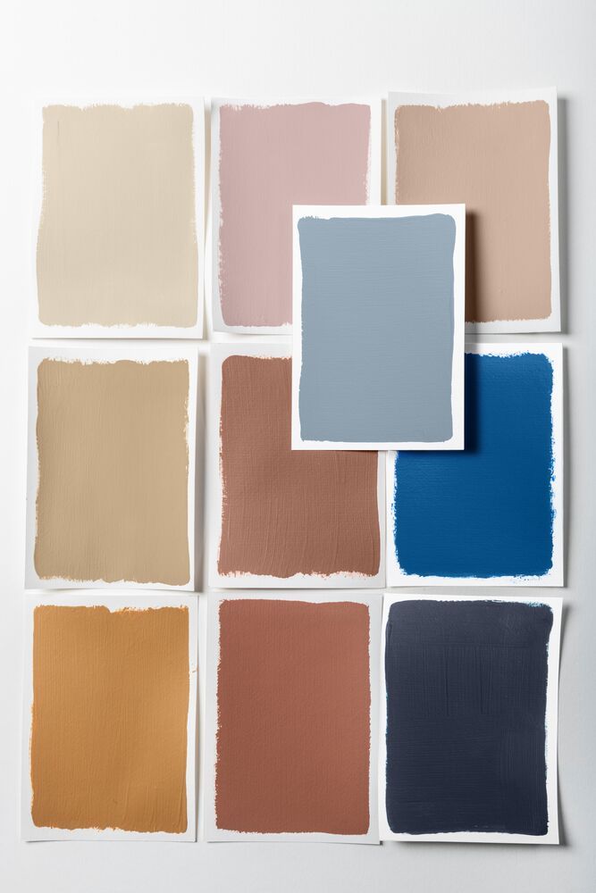nine paint swatches of neutrals and blues depicting a palette that supports a light blue paint color.