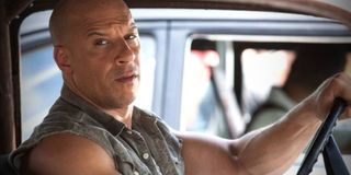 The Fate of The Furious Vin Diesel behind the wheel of one of his racing cars