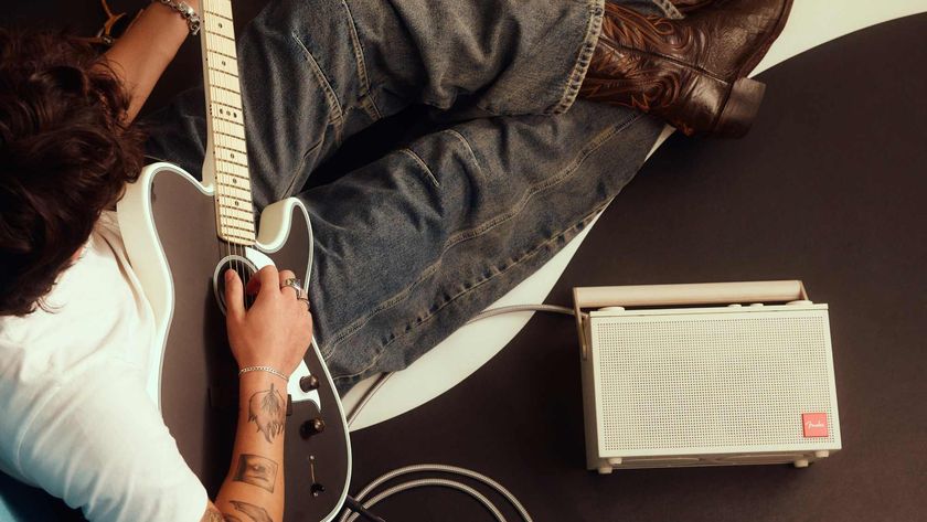 The Fender Elie 6 next to a man playing guitar.