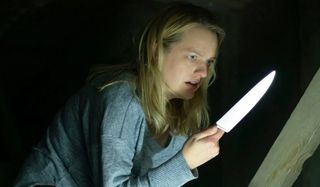 The Invisible Man Elizabeth Moss stares at a knife