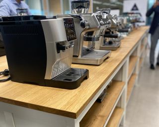 Several De'Longhi coffee makers on display at the brand headquarters