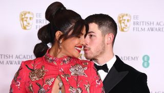 wards Presenter Priyanka Chopra Jonas with her husband Nick Jonas attend the EE British Academy Film Awards 2021 at the Royal Albert Hall on April 11, 2021 in London, England.