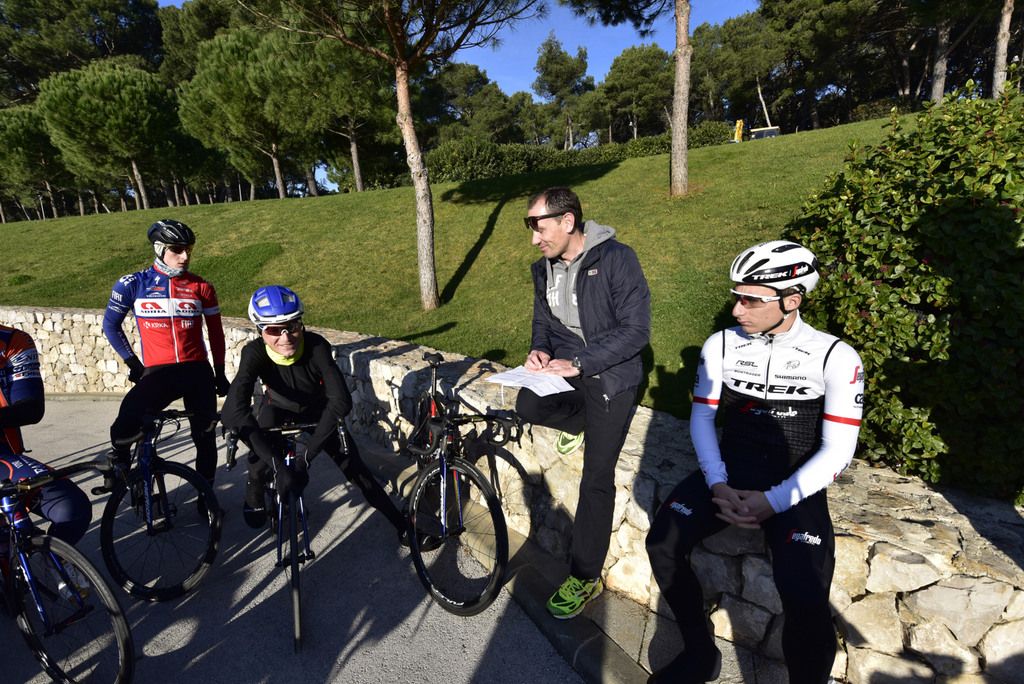 The riders enjoy a moment in the sun before a training ride