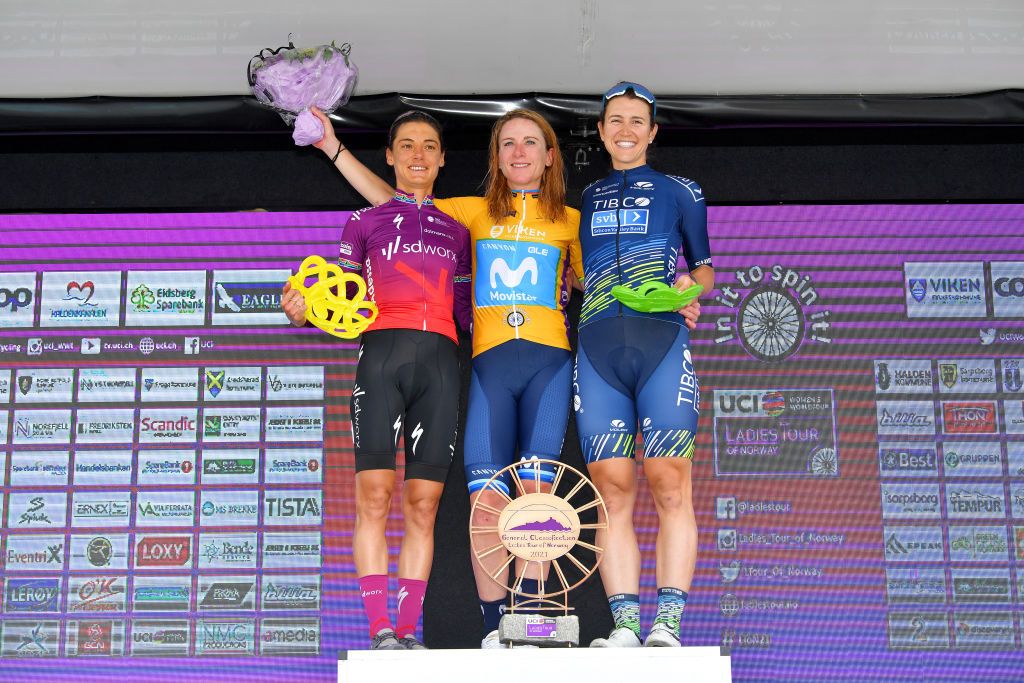 HALDEN NORWAY AUGUST 15 LR Ashleigh Moolman Pasio of South Africa and Team SD Worx on second place stage winner Annemiek Van Vleuten of Netherlands and Movistar Team Women yellow leader jersey and Kristen Faulkner of United States and Team Tibco Silicon Valley Bank on third place pose on the podium during the podium ceremony after the 7th Ladies Tour Of Norway 2021 Stage 4 a 1416km stage from Drbak to Halden LTourOfNorway LTON21 UCIWWT on August 15 2021 in Halden Norway Photo by Luc ClaessenGetty Images
