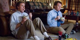 Step Brothers Dale and Brennan watching TV while eating snacks